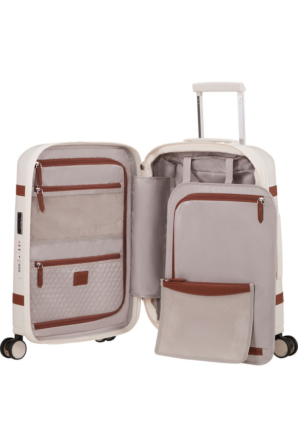Unisex cabin trolley by Samsonite with durable hard shell, compact design, and four spinner wheels for easy travel.