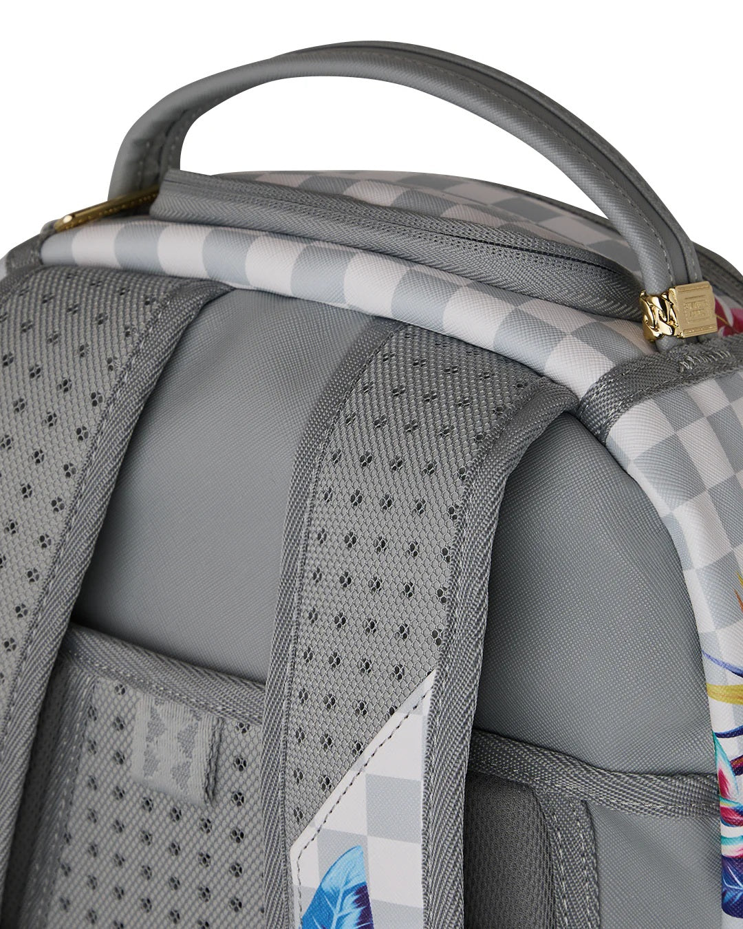 Unisex Jungle Shark Backpack by Sprayground featuring a cream floral design with jungle and shark motifs, styled for casual use.